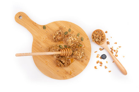 Energy bars with granola and chocolate on a white background.