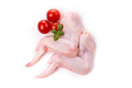 Raw chicken legs with skin on a white background.の写真素材