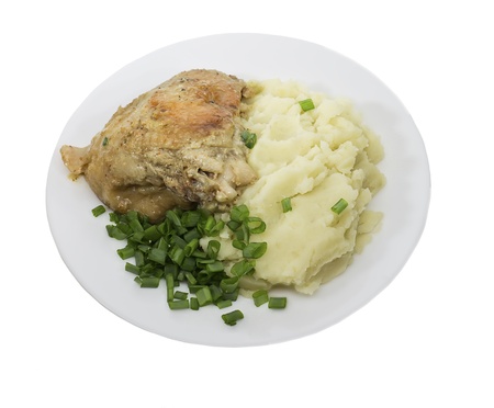 mashed potatoes with chicken and onions on a white backgroundの写真素材