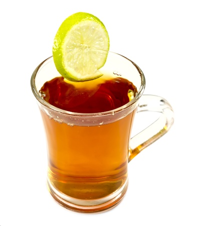 Tea in glass cup with a slice of lemon isolated on a white backgroundの写真素材