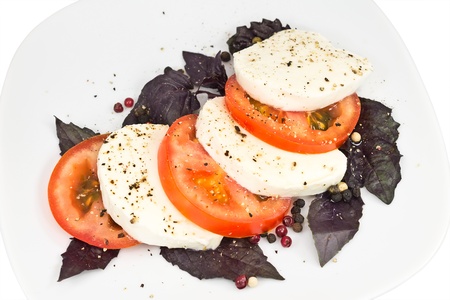 salad of tomato, mozzarella, basil and pepperの写真素材