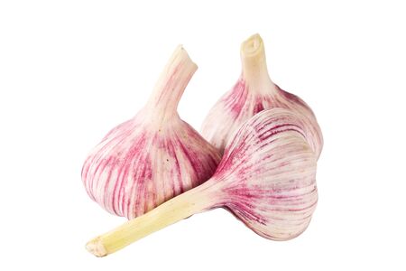 three heads of garlic isolated on white backgroundの写真素材