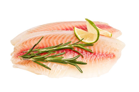 tilapia fillet with a slice of lemon and rosemary isolated on white backgroundの写真素材