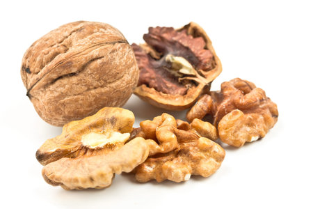 walnut and broken shells isolated on white background