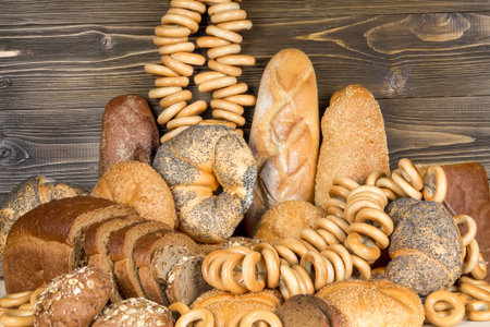 Bread and bagels on a wooden background