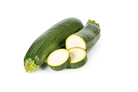 Zucchini with sliced ââisolated on a white background の写真素材