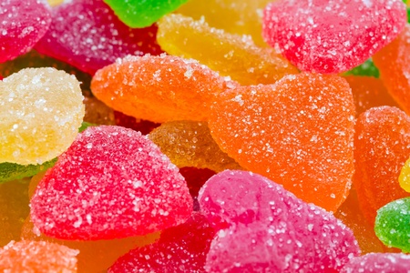 Colorful fruit candy in sugar in the form of heartsの写真素材