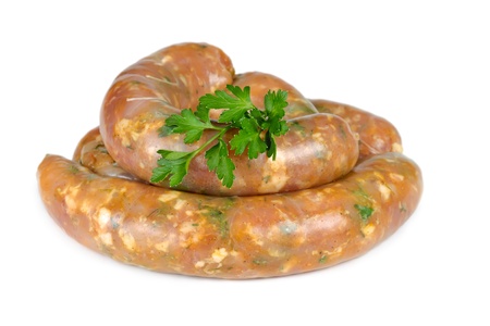 Raw German sausages with parsley isolated on white backgroundの写真素材