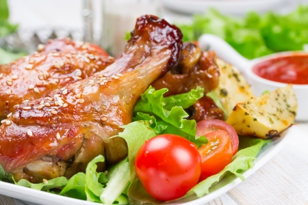 Fried chicken legs with teriyaki sauce and sesame seedsの写真素材