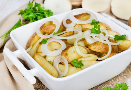 Stewed potatoes in a white ceramic bowl の写真素材
