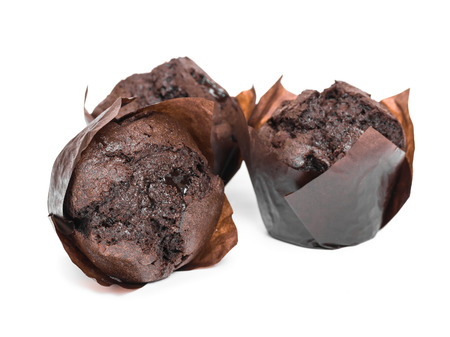 Chocolate muffins isolated on white background, close-up.の写真素材