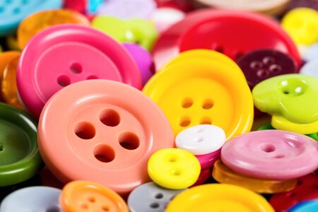 Background from of colorful buttons of different shapes, close-up.の写真素材