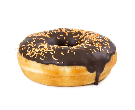 Donut with chocolate icing and sprinkles isolated on white backgroundの写真素材