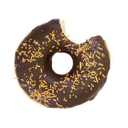 Bitten chocolate donut isolated on white background. Top view.の写真素材