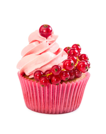 Cupcake with pink cream and red currant isolated on white backgroundの写真素材