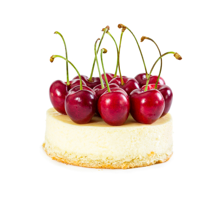 Cheesecake with fresh sweet cherries isolated on white background.の写真素材