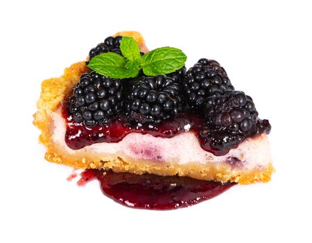 Piece of cheesecake with fresh blackberries and mint isolated on white background.の写真素材