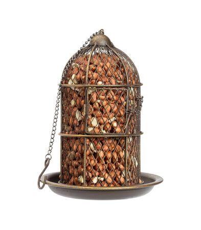 Bunker type bird feeder in vintage style with raw peanats isolated on white background.の写真素材