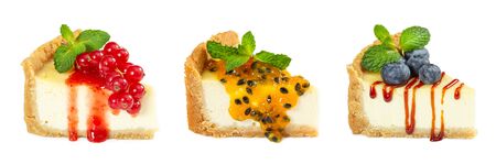 Set of cheesecake with passion fruit, blueberries and red currants isolated on white background.の写真素材