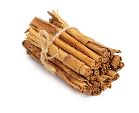 True cinnamon isolated on white background, close-up.