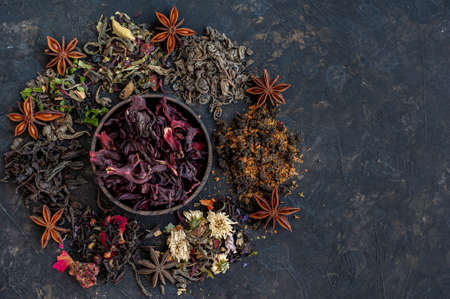 Composition from different types of tea on a dark background. A place for text.の写真素材