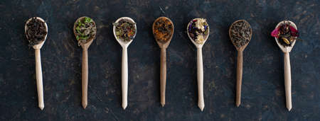 Composition from different types of tea on a dark background. Banner.の写真素材