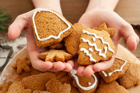 The process of cooking Christmas gingerbread. The boy cuts the gingerbread out of the dough....