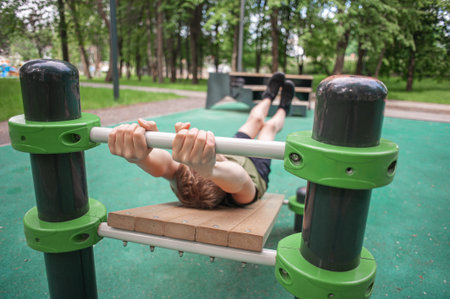 teenager boy goes in for sports on simulators outdoors. hands close up Healthy activity of...