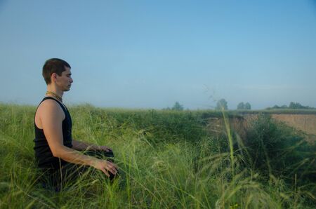 Yoga in the nature: Strength, harmony and tranquilityの写真素材