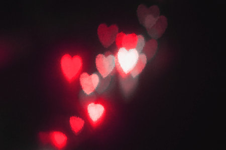 abstract red heart bokeh vision bright fantasy on black background design in red frame with red...