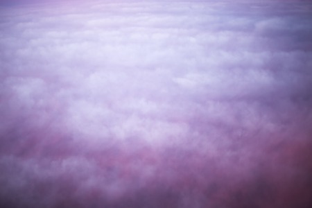 Pink and purple fluffy clouds high in the sky, nature photoの写真素材