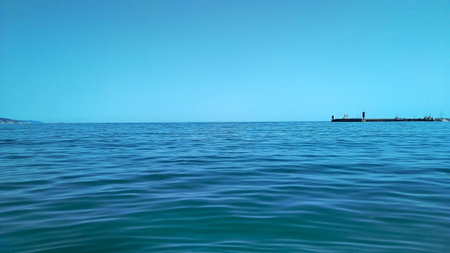 Calm smooth blue sea under the blue sky, nobody