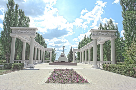 Colonnade  the park at summer on the blue sky