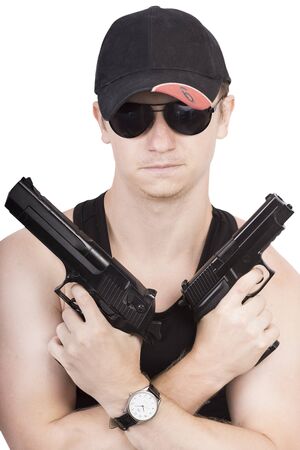 confident man with two guns and wristwatchの写真素材