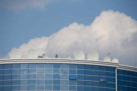 satellite plates on the building with sky