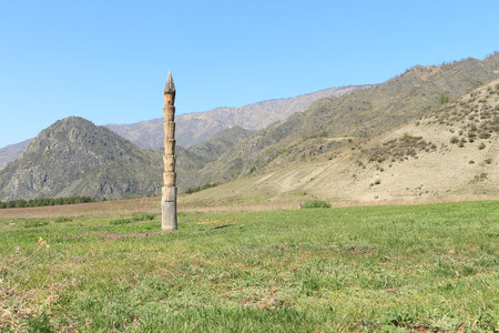 Hitching post standing on a mountain pastureの写真素材