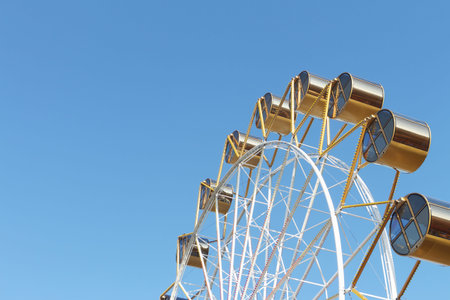 Ferris wheel against the blue sky