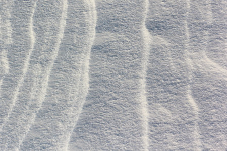 Snow on the frozen surface of the river at sunset, a natural background