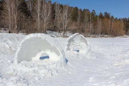 Igloo unfinished on a snow glade in the winter