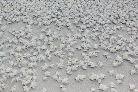 Snow frost on the ice on the river, natural backgroundの写真素材