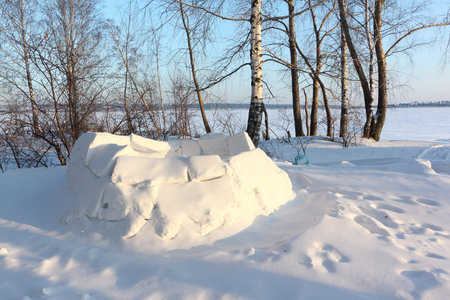 Igloo unfinished on a snow glade in the winter, Siberia, Russia