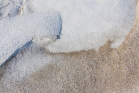 Snow and frozen sand by the river, natural background, Ob River, Siberia, Russiaの写真素材