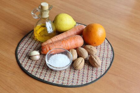 Vegetable oil, orange, carrots, lemon, walnuts, garlic, salt for saladの写真素材