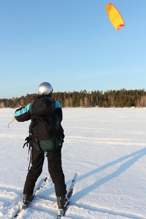 Man training in snow kiting on frozen reservoir, Novosibirsk, Russiaの写真素材