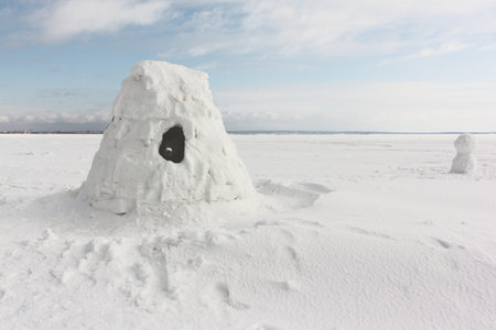 Igloo  standing on a snowy  reservoir in the winter, Novosibirsk, Russiaの写真素材
