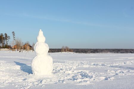 Snowman standing on a frozen river, Novosibirsk, Russiaの写真素材