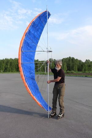 Man training in roller skating with a kite, Novosibirsk, Russiaの写真素材