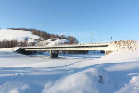 Automobile bridge over the Isha river in spring, Altai Territory, Russiaの写真素材
