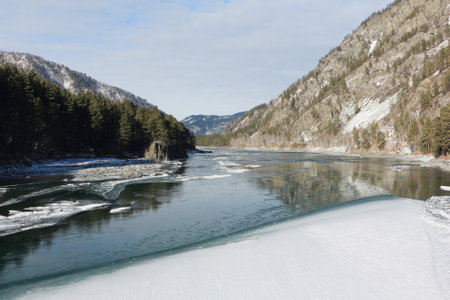 Katun river covered with ice in autumn, village of Barangol, Altai Republic, Russiaの写真素材