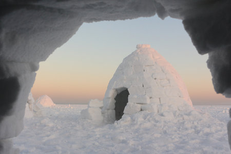 View from an igloo to another igloo in winter at sunset, Ob reservoir, Novosibirsk, Russiaの写真素材